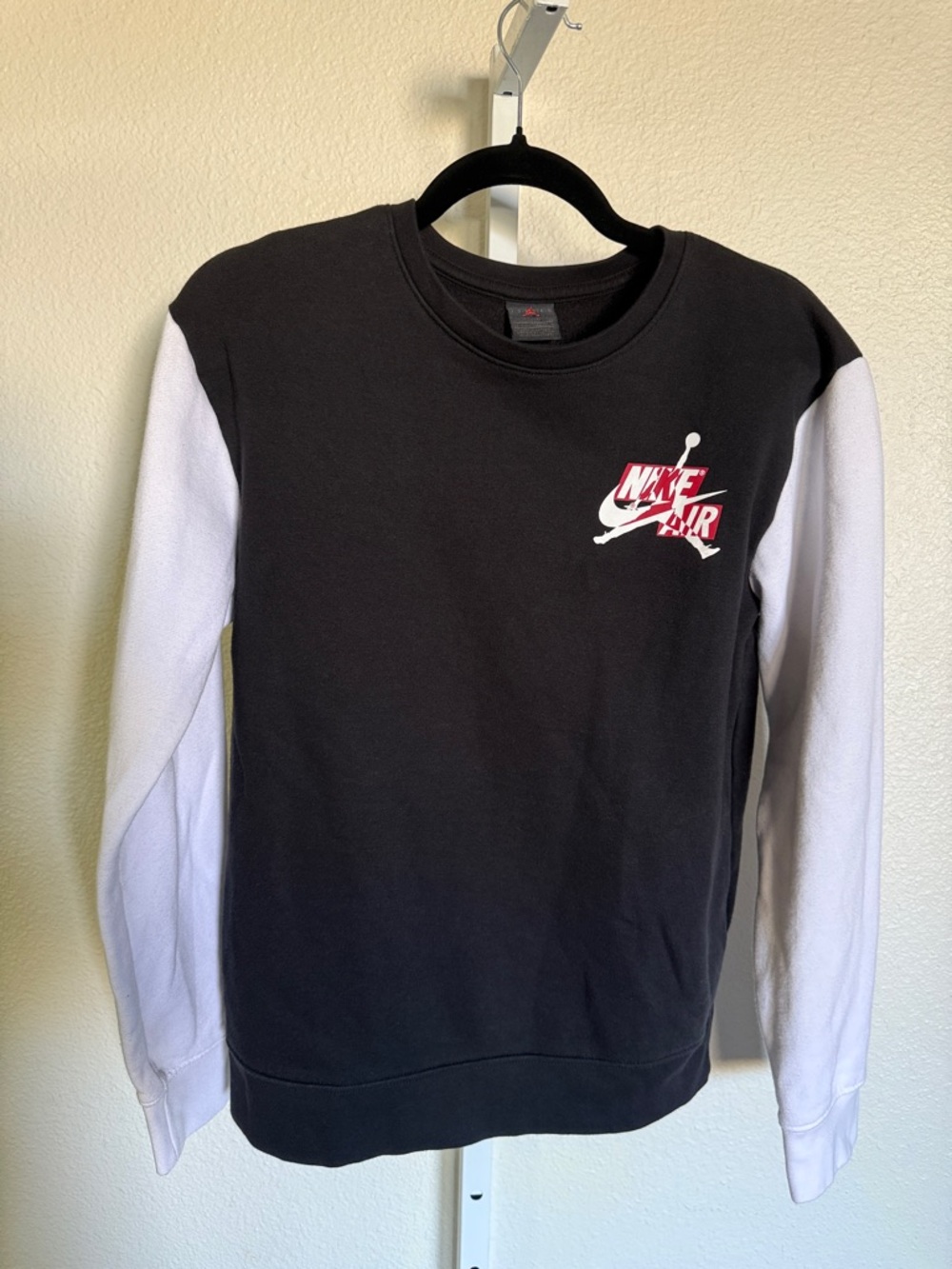 Nike Air Jordan Black Crewneck Sweatshirt with White Sleeves and Red Logo